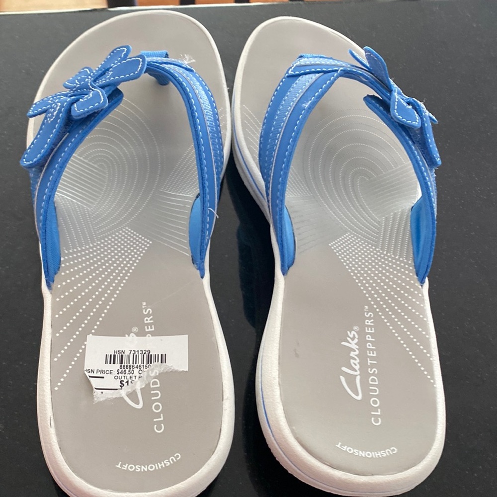 Clark's cloud steppers.  Blue with flower.  Size 8 in Women’s.  New